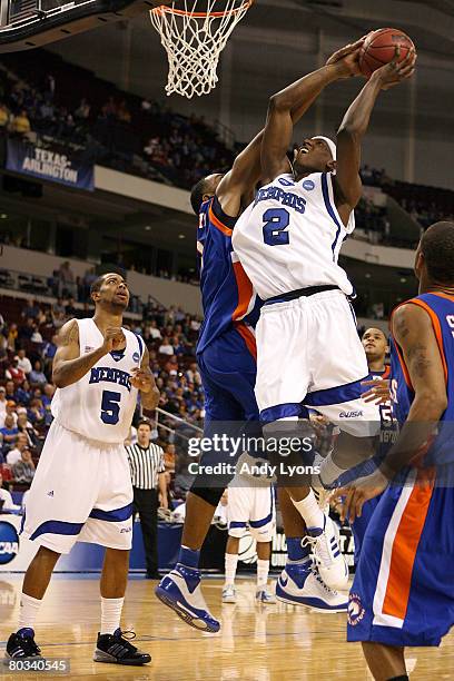 Robert Dozier of the Memphis Tigers goes up for a shot against Jermaine Griffin of the Texas-Arlington Mavericks during the first round of the South...