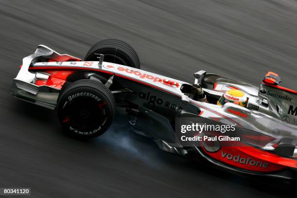 Lewis Hamilton of Great Britain and McLaren Mercedes in action during qualifying for the Malaysian Formula One Grand Prix at the Sepang Circuit on...