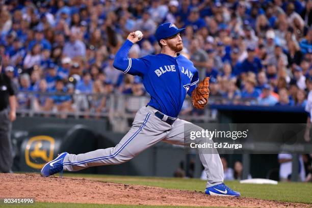 Danny Barnes of the Toronto Blue Jays throws against the Kansas City Royals at Kauffman Stadium on June 23, 2017 in Kansas City, Missouri.