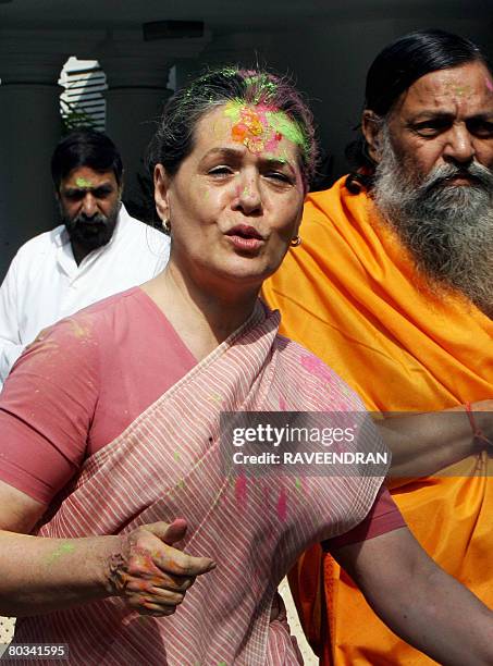 Chairperson of the Congress-led UPA government and Congress Party President Sonia Gandhi celebrates "Holi" with party supporters in New Delhi on...