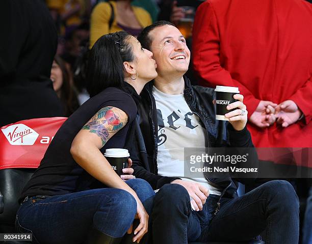 Chester Bennington and his wife Talinda Bentley attend the Los Angeles Lakers vs Seattle Supersonics at the Staples Center on March 21, 2008 in Los...