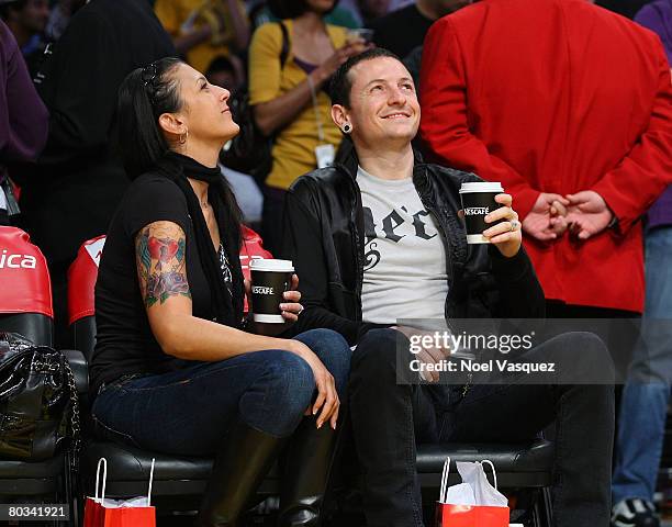 Chester Bennington and his wife Talinda Bentley attend the Los Angeles Lakers vs Seattle Supersonics at the Staples Center on March 21, 2008 in Los...