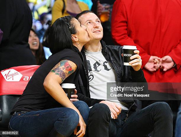 Chester Bennington and his wife Talinda Bentley attend the Los Angeles Lakers vs Seattle Supersonics at the Staples Center on March 21, 2008 in Los...
