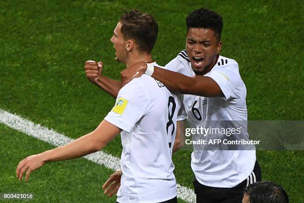 Germany's midfielder Leon Goretzka celebrates Germany's defender Benjamin Henrichs after scoring during the 2017 Confederations Cup semi-final...