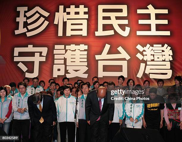 Taiwan's presidential candidate Frank Hsieh of the ruling Democratic Progressive Party and his running mate Su Tseng-chang bow to supporters after...