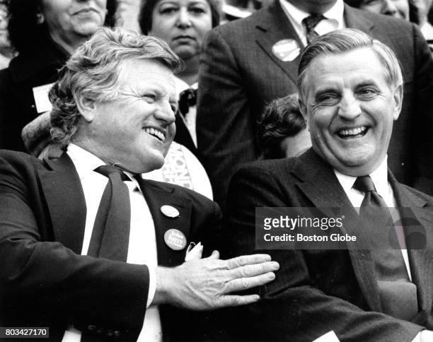 Senator Edward M. Kennedy pats presidential candidate Walter Mondale on the shoulder before Mondale's speech at a campaign rally on Boston Common on...