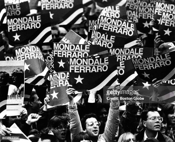 Supporters hold up signs during a campaign rally for presidential candidate Walter Mondale at the Boston Common on Nov. 2, 1984.