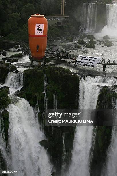 Metre-high inflatable device with the shape of a local domestic water filter is seen from the Brazilian side of the border with Argentina, on March...