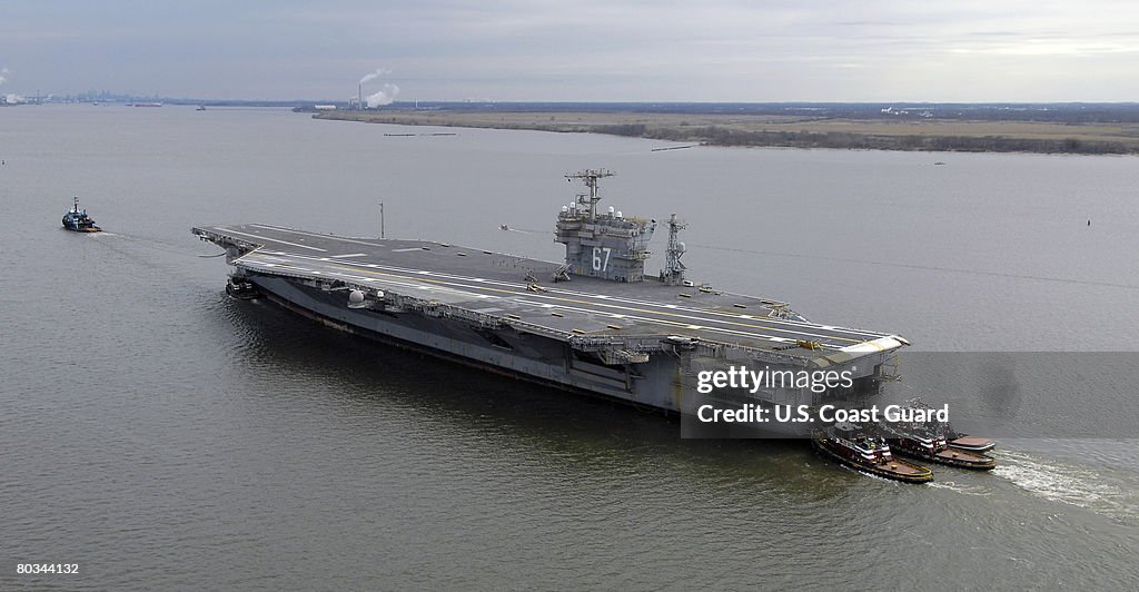 USS John F. Kennedy Towed To Navy Inactive Ships Maintenance Facility