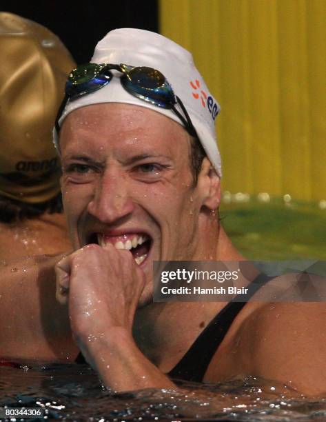 Alain Bernard of France reacts after winning the gold medal and breaking the world record in the Final of the Men's 100m Freestyle during day ten of...