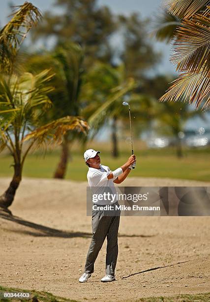 Bo Van Pelt hits out of the waste area on the 12th hole during the third round of the Puerto Rico Open presented by Banco Popular held on March 22,...