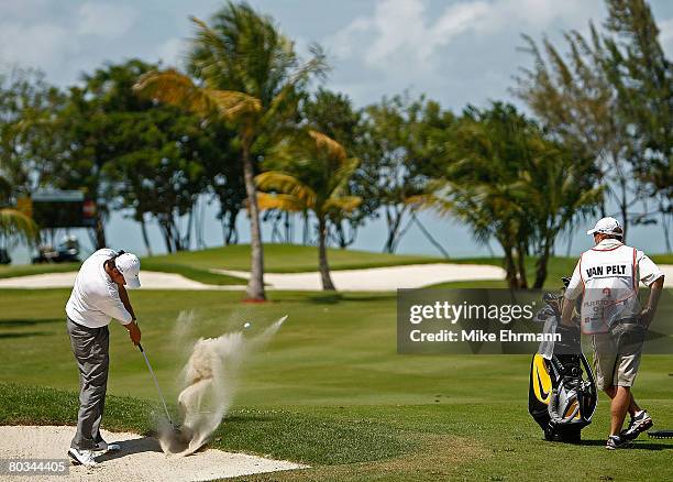 Bo Van Pelt hits out of the sand on the 11th hole during the third round of the Puerto Rico Open presented by Banco Popular held on March 22, 2008 at...