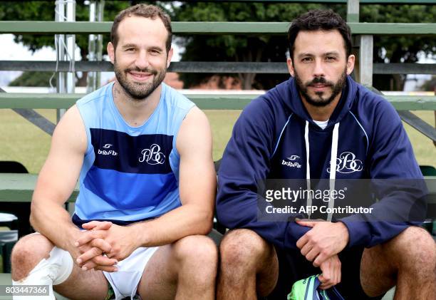 Barbarians' rugby player and former Sharks' player Frederic Michalak poses with Sharks' French fullback Clement Poitrenaud during a training session...