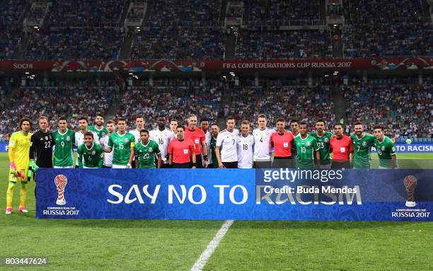 Players and match officials stand with an anti racism banner prior to the FIFA Confederations Cup Russia 2017 Semi-Final between Germany and Mexico...