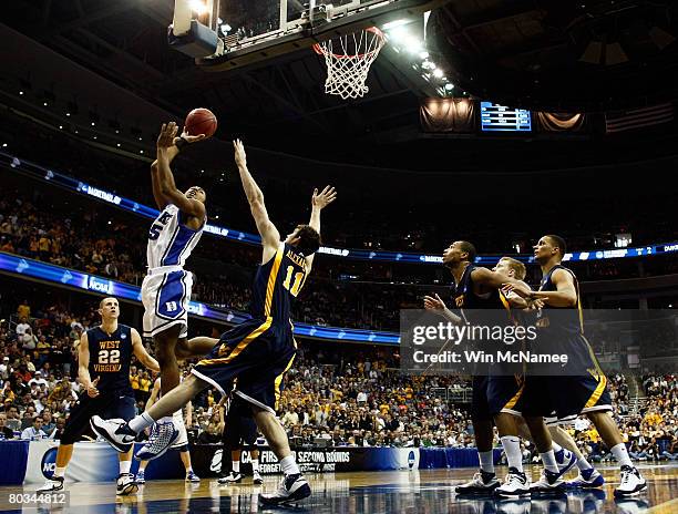 Gerald Henderson of the Duke Blue Devils shoots the ball against Joe Alexander of the West Virginia Mountaineers during the second round of the West...