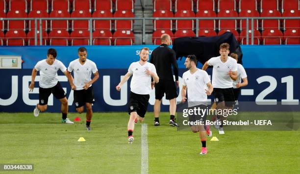 Players of Germany run to warm up during the MD-1 training session of the U21 national team of Germany at Krakow stadium on June 29, 2017 in Krakow,...