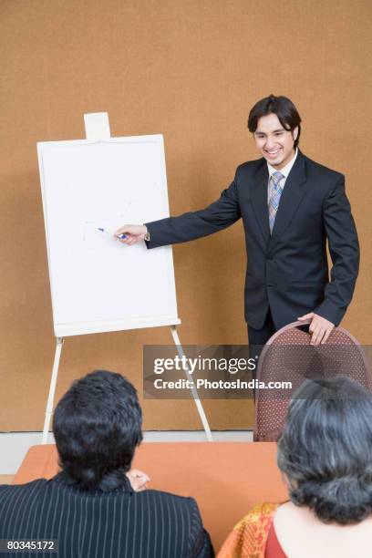 businessman giving presentation in a meeting - business person handing over a letter fotografías e imágenes de stock