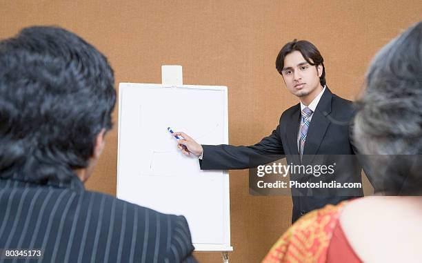 businessman giving presentation in a meeting - business person handing over a letter fotografías e imágenes de stock