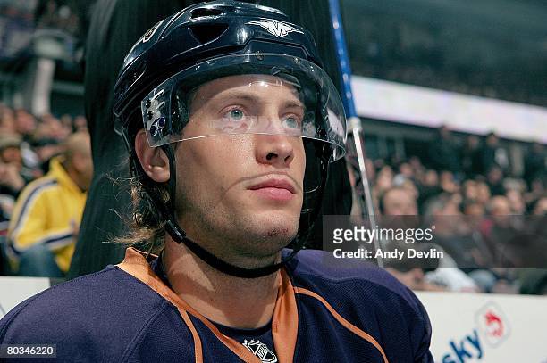 Tom Gilbert of the Edmonton Oilers sits on the bench during a game against the Phoenix Coyotes on March 18, 2008 in Edmonton, Alberta, Canada.