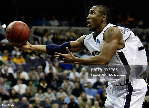 Stanley Burrell of the Xavier Musketeers goes to the hoop against the Purdue Boilermakers during the second round of the West Regional as part of the...