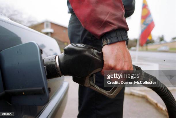 Gas attendant pumps gas April 18, 2001 at a Mobil Station in West Roxbury, MA. Prices have stayed steady in the Northeast, while rising in the New...