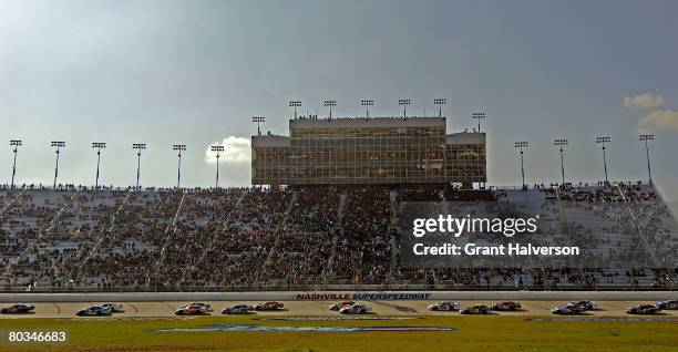 Drivers parade past the grandstand on a caution lap during the NASCAR Nationwide Series Pepsi 300 presented by Kroger at the Nashville Superspeedway...