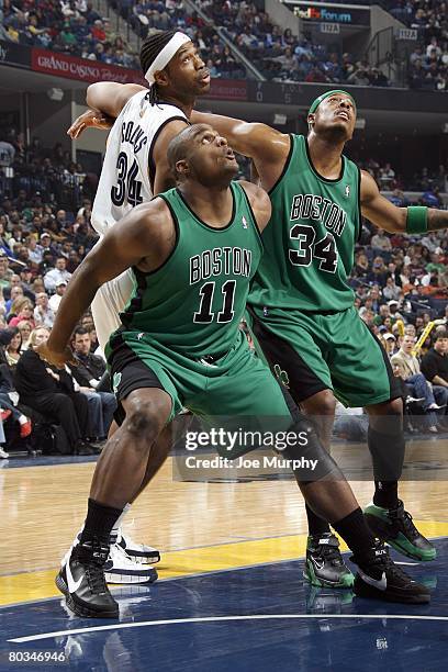 Glen Davis and Paul Pierce of the Boston Celtics guard Jason Collins of the Memphis Grizzlies during the game on March 8, 2008 at FedExForum in...