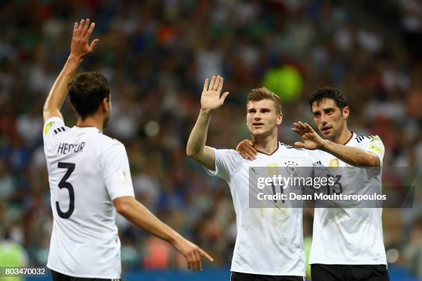 Timo Werner of Germany celebrates scoring his side's third goal with his team mates Jonas Hector and Lars Stindl of Germany during the FIFA...