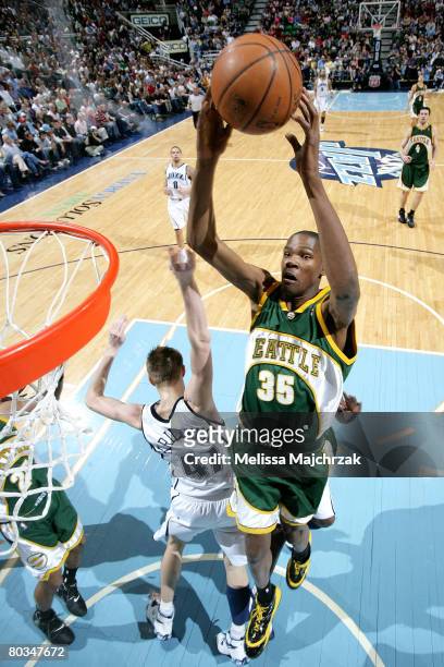 Kevin Durant of the Seattle Sonics has the ball knocked loose by Andrei Kirilenko of the Utah Jazz at EnergySolutions Arena on March 22, 2008 in Salt...