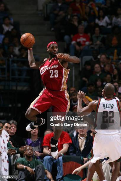 LeBron James of the Cleveland Cavaliers passes against Micahel Redd of the Milwaukee Bucks at the Bradley Center March 22, 2008 in Milwaukee,...