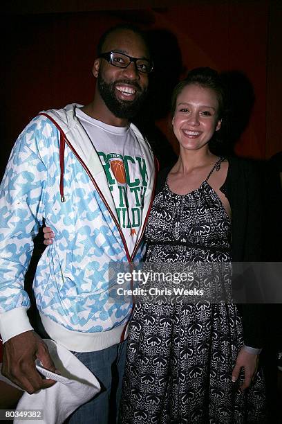 Player Baron Davis, left, and actress Jessica Alba attend Davis' birthday at Stone Rose Lounge on March 22, 2008 in Beverly Hills, CA.