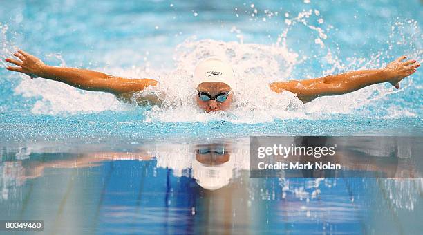 Lisbeth Trickett of Queensland competes in the womens 100 metre butterfly during day two of the 2008 Australian Swimming Championships at the Sydney...