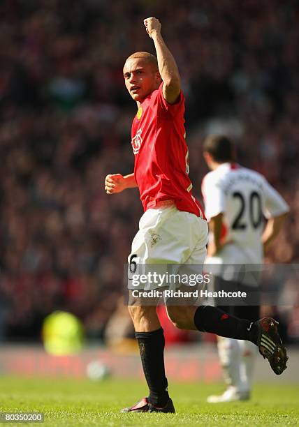 Wes Brown of Manchester United celebrates scoring the opening goal during the Barclays Premier League match between Manchester United and Liverpool...