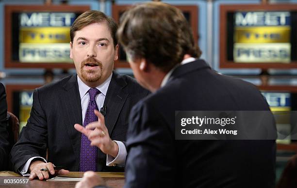 News Political Director Chuck Todd , speaks as moderator Tim Russert looks on during a taping of "Meet the Press" at the NBC studios March 23, 2008...