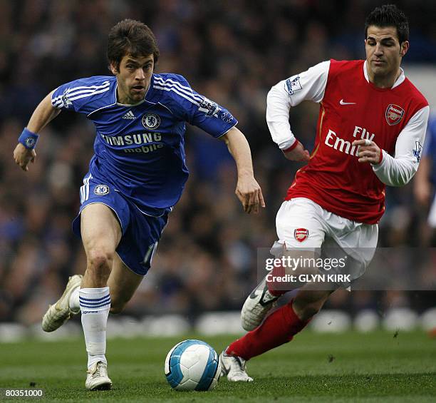 Chelsea's English Midfielder Joe Cole vies with Arsenal's Spanish Midfielder Cesc Fabregas during their Premiership match against Arsenal at Stamford...