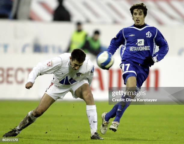 Kirill Kombarov of FC Dynamo Moscow competes for the ball with Nikola Miyalovich of FC Khimki during the Russian Football League Championship match...