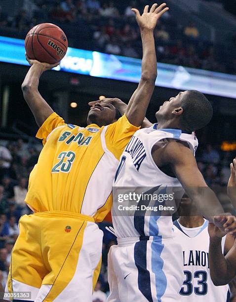 Edwin Ubiles of the Siena Saints goes up for a shot against Corey Fisher of the Villanova Wildcats in the second round of the 2008 NCAA Tournament...