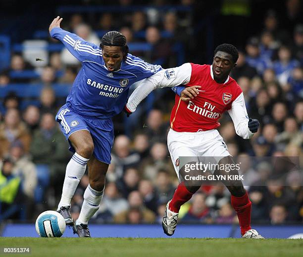 Chelsea's Ivory Coast Striker Didier Drogba vies with Arsenal's countryman defender Kolo Toure during their Premiership match against Arsenal at...