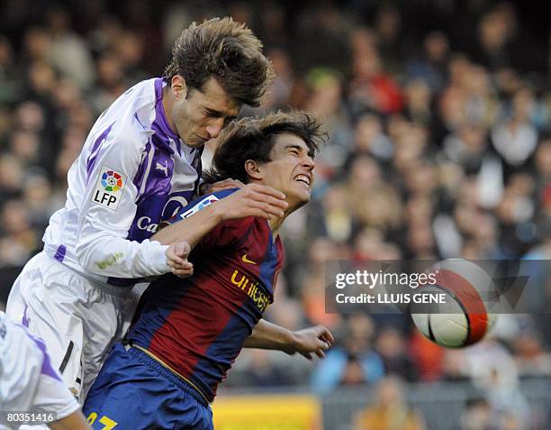 Barcelona's Bojan vies with Valladolid's Alvaro Rubio during their Spanish League football match on March 23, 2008 at Camp Nou stadium in Barcelona....