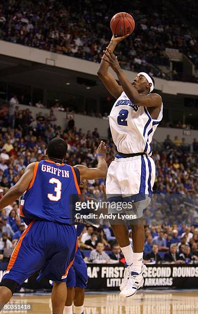 Robert Dozier of the Memphis Tigers shoots over Jermaine Griffin of the Texas-Arlington Mavericks during the first round of the South Regional as...