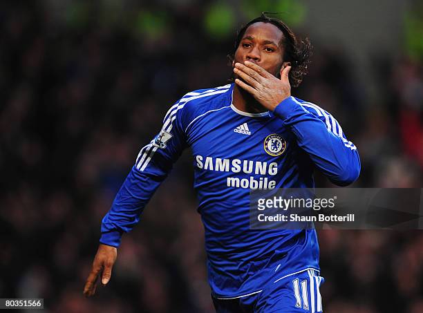 Didier Drogba of Chelsea celebrates as he scores their second goal during the Barclays Premier League match between Chelsea and Arsenal at Stamford...