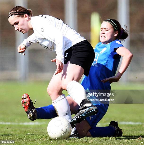 Stephanie Kaiser of Saarbruecken in action with Irmela Koch of Koeln during the Women's DFB Cup semi final match between TuS Koeln and 1. FC...