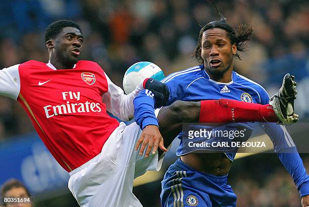 Chelsea's Didier Drogba of Ivory Coast vies with Arsenal's countryman Kolo Toure during their Premiership match at home to Chelsea at Stamford Bridge...