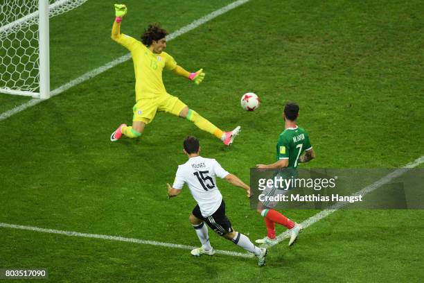Amin Younes of Germany scores his side's fourth goal past Guillermo Ochoa of Mexico during the FIFA Confederations Cup Russia 2017 Semi-Final between...