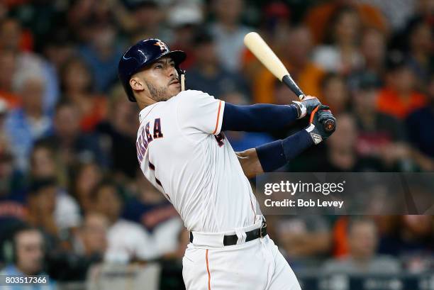 Carlos Correa of the Houston Astros hits a two-run home run in the fourth inning against the Oakland Athletics at Minute Maid Park on June 29, 2017...