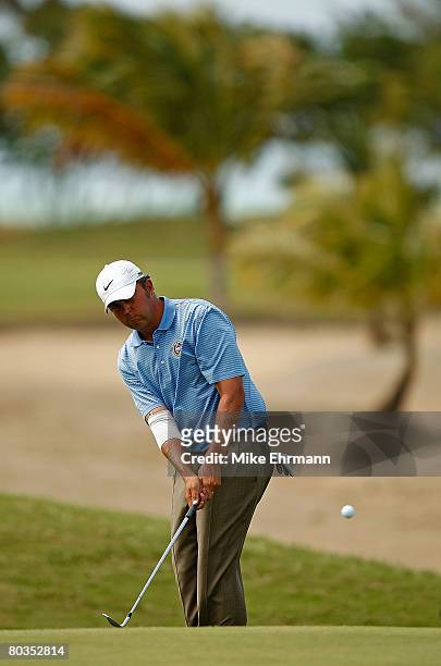 Bo Van Pelt chips to the green on the 12th hole during the final round of the Puerto Rico Open presented by Banco Popular held on March 23, 2008 at...