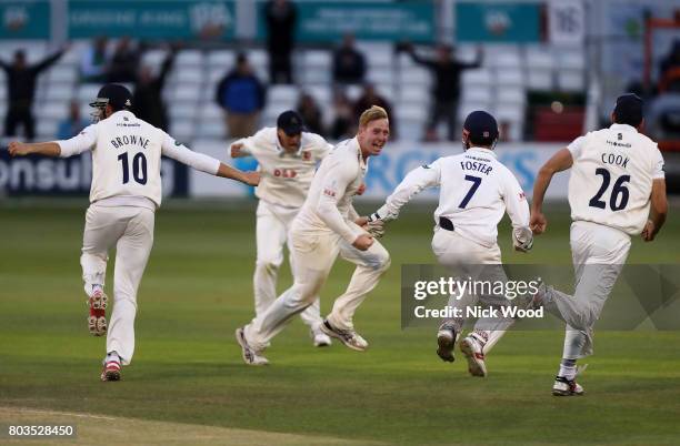 Simon Harmer of Essex celebrates taking the final wicket during the Essex v Middlesex - Specsavers County Championship: Division One cricket match at...