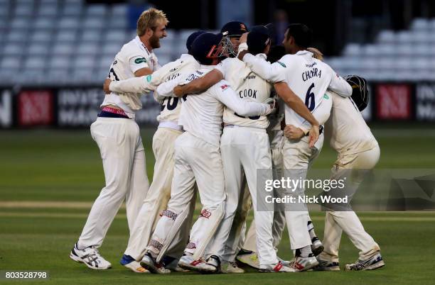 Essex players celebrate winning the match during the Essex v Middlesex - Specsavers County Championship: Division One cricket match at the Cloudfm...