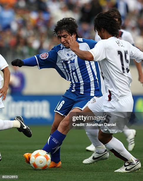 Luis Alfredo Lopez of Honduras drives against Kamani Hill of the United States during the final match in the CONCACAF U-23 Men's Olympic Qualifying...