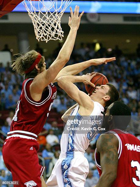 Charles Thomas looks on as Steven Hill of the Arkansas Razorbacks defends against Tyler Hansbrough of the North Carolina Tar Heels during the 2nd...